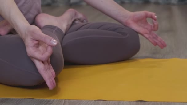 Woman meditating. young woman doing yoga exercise at home for stress relief relaxing from work. Dolly slider shot — Stock Video