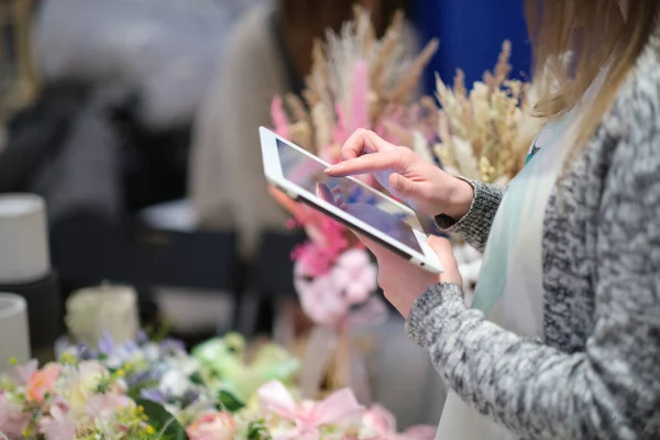 woman entrepreneur uses a tablet to advertise their products and communicate with customers. online retail. concept of promoting an entrepreneur on the internet.