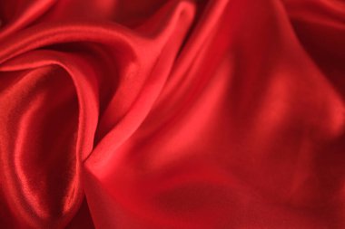 Örtülü kırmızı kadife arka planın soyut dokusu. Tekstil arka planı. Yakın plan. Üst görünüm