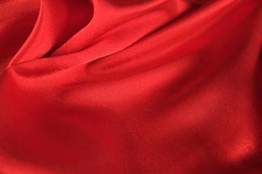 Örtülü kırmızı kadife arka planın soyut dokusu. Tekstil arka planı. Yakın plan. Üst görünüm