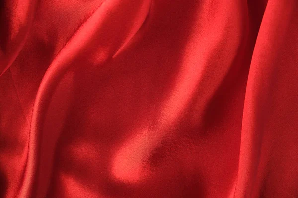 ドレープレッドベルベットの背景の抽象的な質感。美しい織物の背景です。接近中だ。トップ表示 — ストック写真