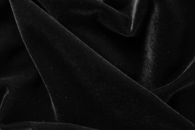 Örtülü siyah arkaplanın soyut dokusu. Tekstil arka planı. Yakın plan. Üst görünüm