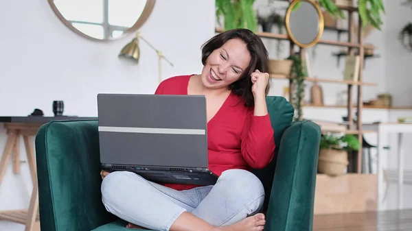 female celebrating good news. woman overjoyed get mail at laptop being promoted at work, girl amazed read good news at computer