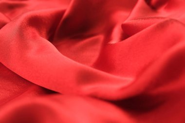 Örtülü kırmızı kadife arka planın soyut dokusu. Tekstil arka planı. Yakın plan. Üst görünüm