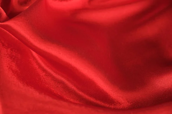 ドレープレッドベルベットの背景の抽象的な質感。美しい織物の背景です。接近中だ。トップ表示 — ストック写真