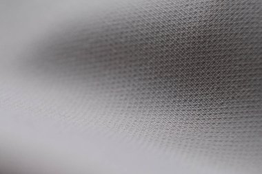 Örtülü bej arkaplanın soyut dokusu. Tekstil arka planı. Yakın plan. Üst Manzara. Yumuşak odaklı, bulanık