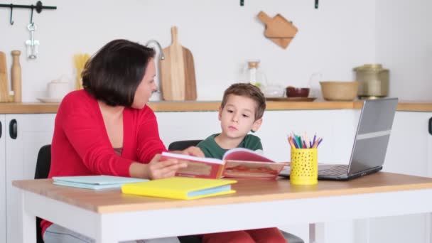 Serious mum lecturing lazy unmotivated schoolboy, children education problem, parent and child conflict. Stressed mother and son frustrated over failure homework. — Stock Video