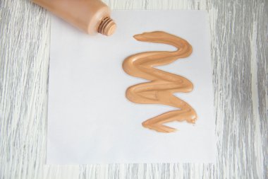Tone cream cosmetic tube Sample of liquid foundation  clipart