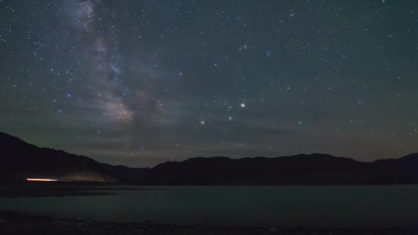 Milky way over the Bartagoy lake — Stock Video