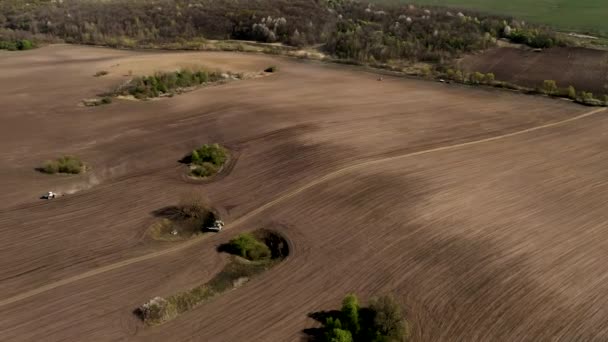 Aerial View Large Tractor Cultivating Dry Field Top Aerial View — Stock Video