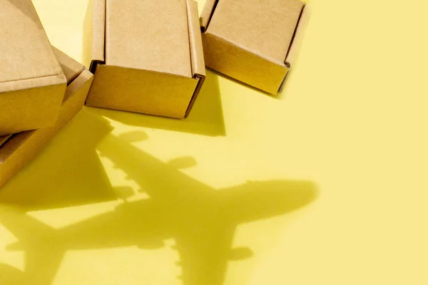 Shadow Airplane Stack Cardboard Boxes Concept Air Cargo Parcels Airmail — Stock Photo, Image