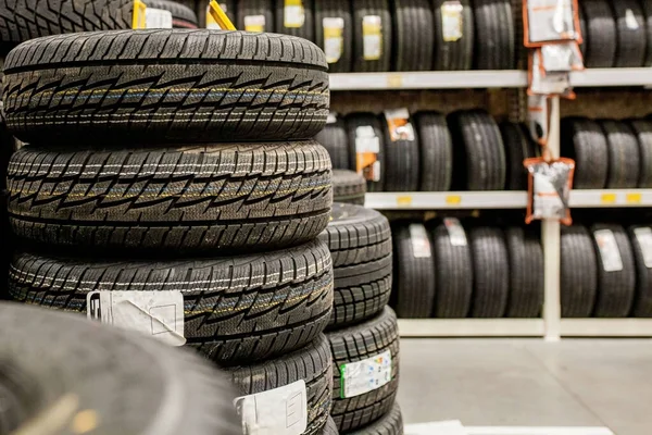 Car tires and wheels at warehouse in tire store