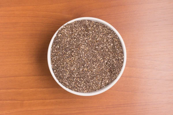 Chia seeds into a bowl — Stock Photo, Image