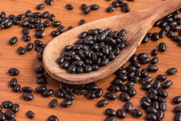 Black beans into a spoon