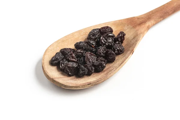 Getrocknete Trauben in einem Löffel — Stockfoto