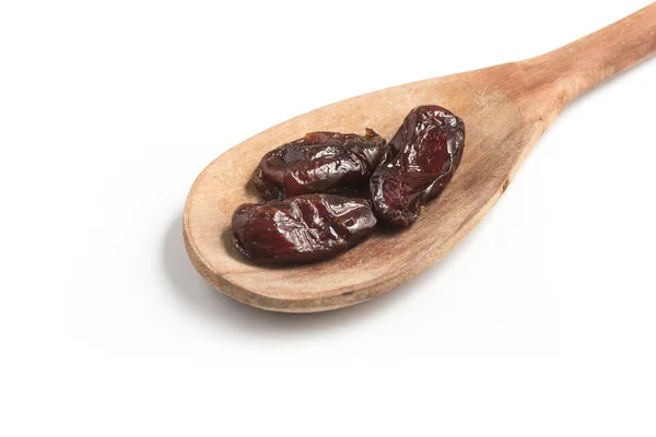 Dried Dates into a spoon. Tamara — Stock Photo, Image