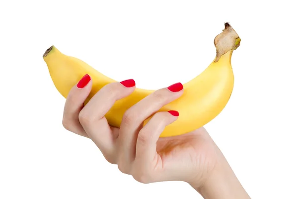 Mujer sexy mano con clavos rojos sosteniendo plátano . — Foto de Stock