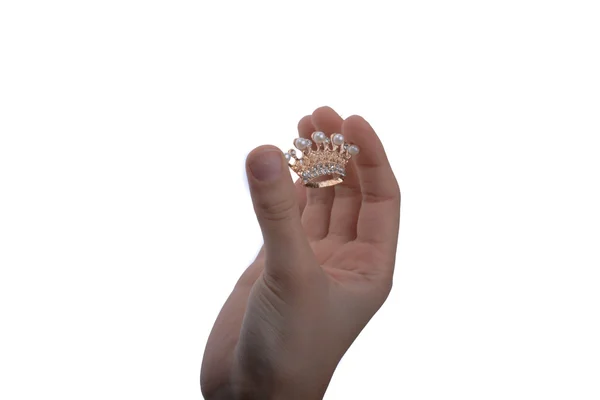 Golden color crown with pearls in hand — Stock Photo, Image