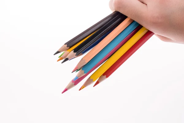 Barevné tužky v ruce — Stock fotografie