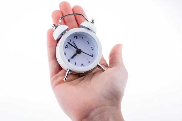 Reloj despertador en mano — Foto de Stock