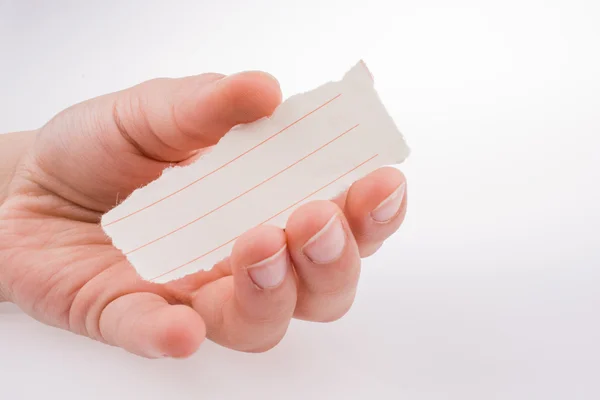 Pezzo di carta foderata in mano — Foto Stock