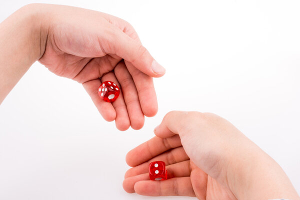 Hand holding red dice