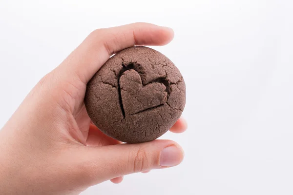 Hand holding a cookie — Stock Photo, Image