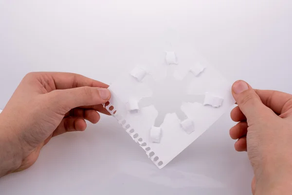 Hand holding paper art