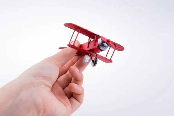 Mano sosteniendo un avión — Foto de Stock