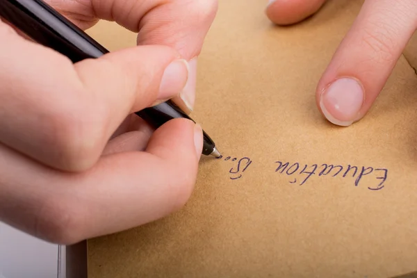 Escribir a mano en un cuaderno — Foto de Stock