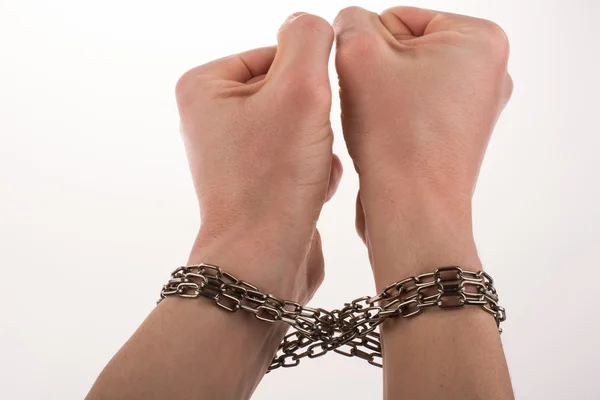 Hands in chains on a white background — Stock Photo, Image