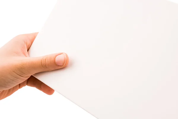 Pedaço de papel na mão — Fotografia de Stock
