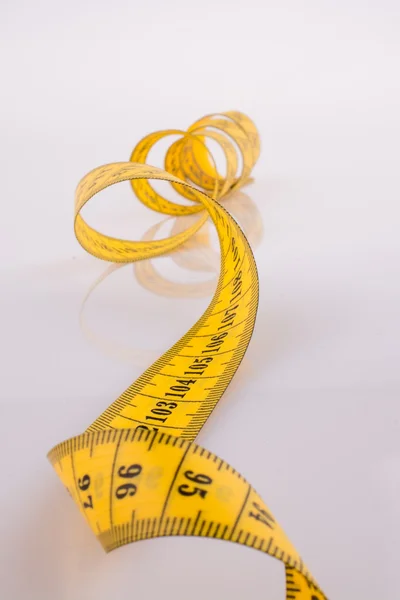 Measuring tape on a white background — Stock Photo, Image