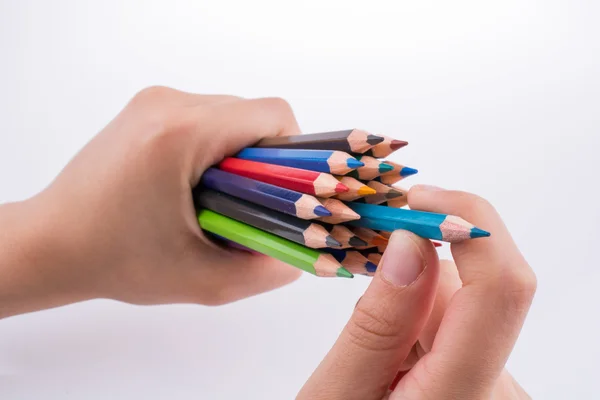 Hand hält Bleistifte — Stockfoto