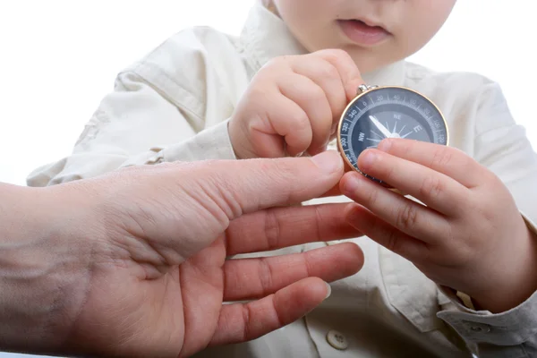 Compass in baby's hand — Stock Photo, Image