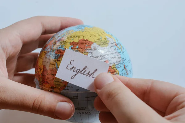 Hand Holding Notepaper Russian Wording Model Globe — стоковое фото