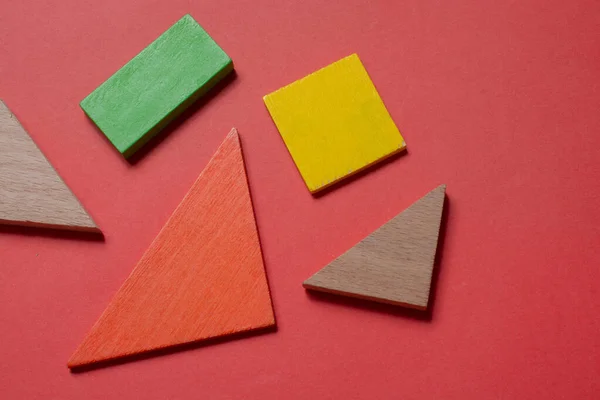 Concept of creative logical thinking. Different colorful wooden blocks. Geometric shapes in different colors.