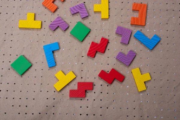 Concept of creative logical thinking. Different colorful wooden blocks. Geometric shapes in different colors.