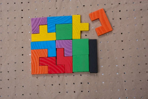 Concept of creative logical thinking. Different colorful wooden blocks. Geometric shapes in different colors.