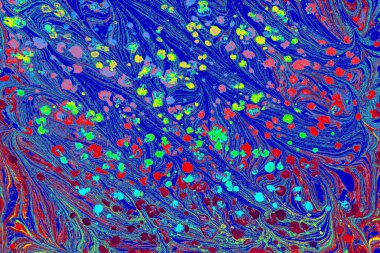 Colorful abstract Ebru marbling background featuring vibrant liquid ink swirls and artistic texture.