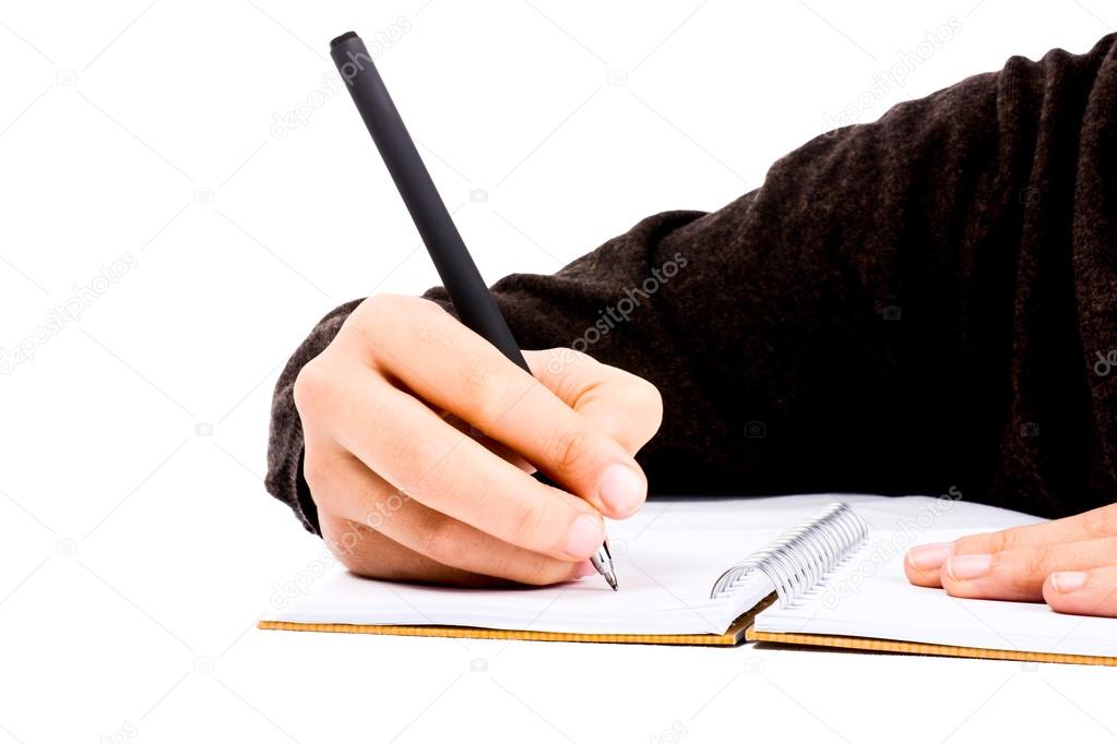 A child hand is writing with pen