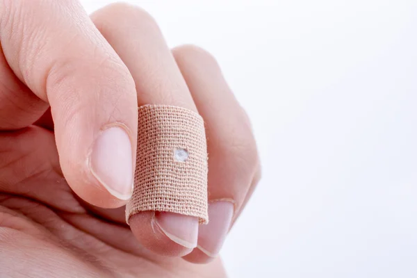 Finger in white bandage — Stock Photo, Image