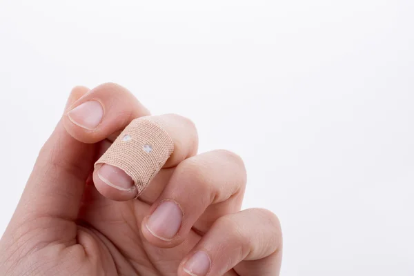 Finger in white bandage — Stock Photo, Image