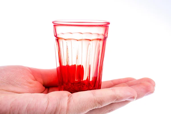 Kolorowy puste szklanki w dłoni — Zdjęcie stockowe