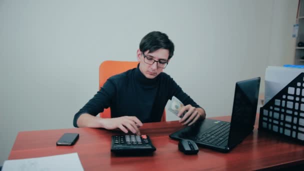 Businessman working with financials, budget, using calculator, counting money. — Stock Video