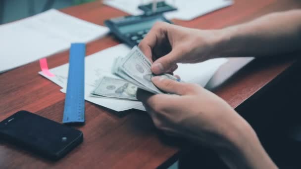 Businessman counting money US dollars on his workplace in office. — Stock Video