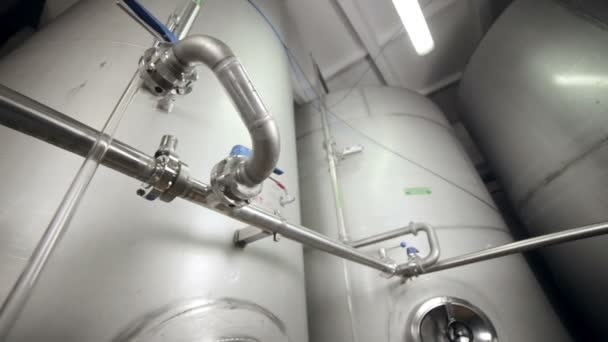 Pipe system, pipelines with valves and storages at modern plant, factory indoor. — Stock Footage Pipe system, pipelines with valves and storages at modern plant, factory indoor. Royalty Free Stock Video