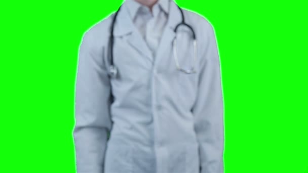 Smiling Doctor giving a hand for help, standing on chroma key background. Packshot. — Stock Video