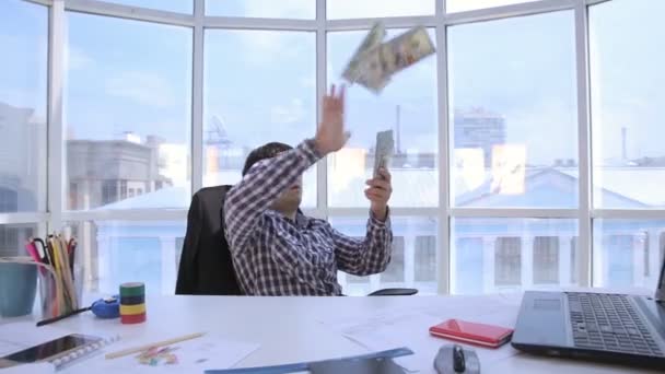 Successful businessman counting and throwing up US dollar money in bright clean office. Business, money, success concept. — Stock Video