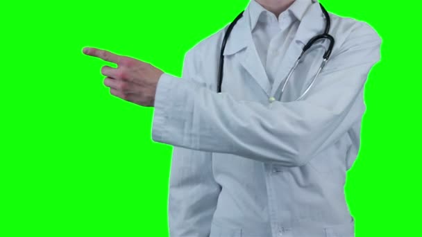 Dokter wijzen op item. Groen scherm. — Stockvideo